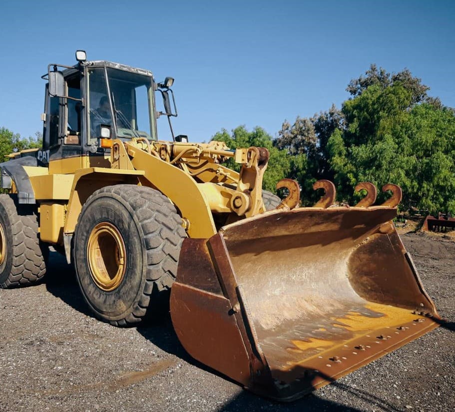 Cargador frontal Caterpillar 950F 1994 — cargador de ruedas de porte grande con cabina - fotografia 1