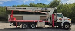 Vista lateral izquierda de grúa Terex TC 4792 sobre Sterling LT9513