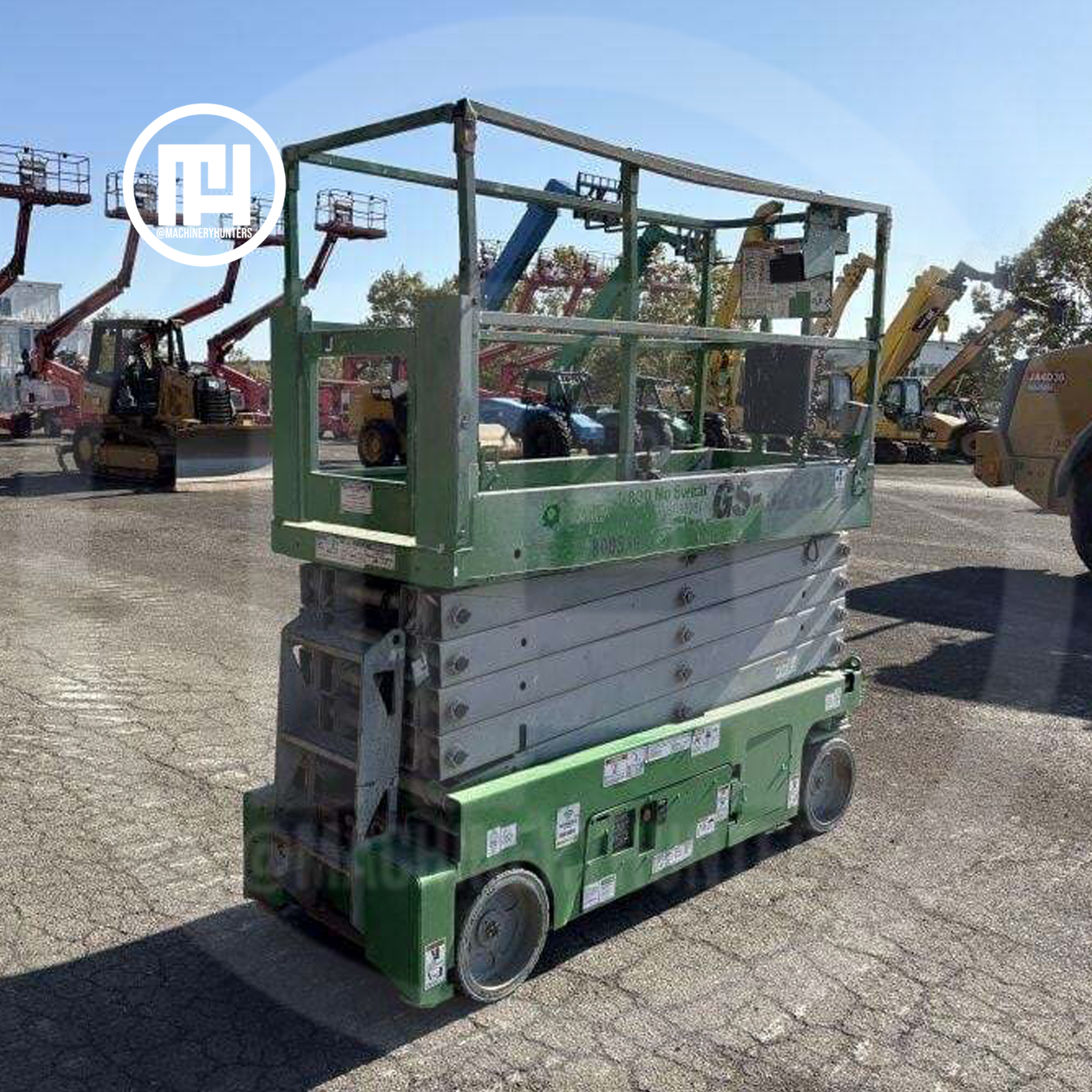 Elevador de tijera Genie GS3232 2015 visto desde ángulo posterior