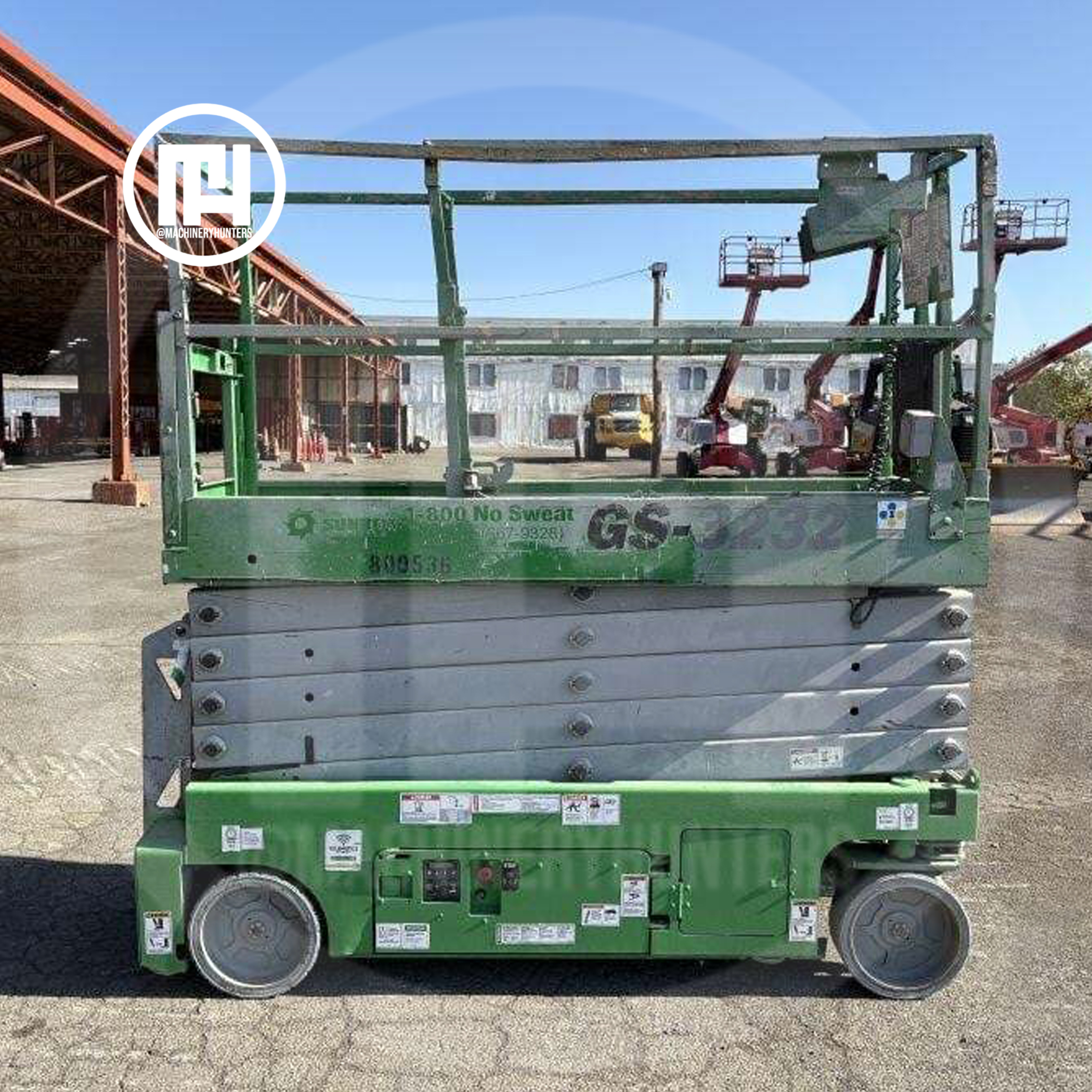 Elevador de tijera Genie GS3232 2015 visto desde el lado